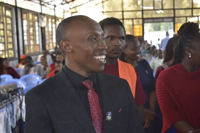 Simon Mugetha smiling during a church service