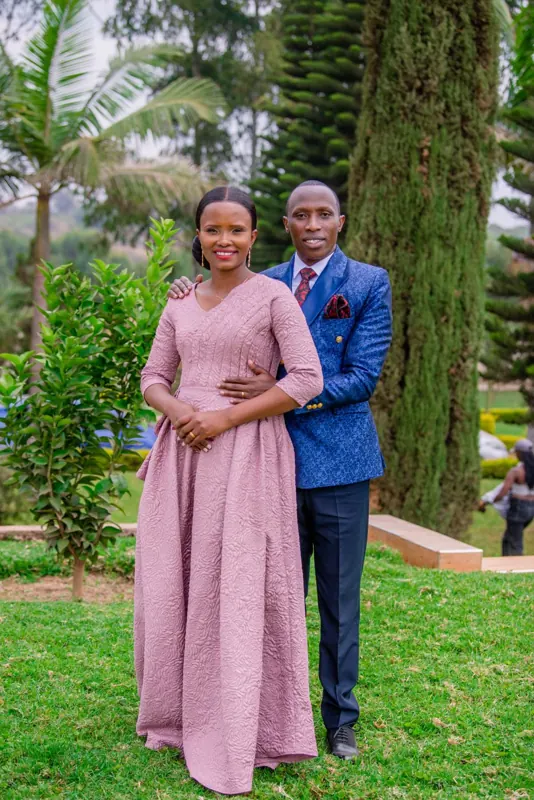Simon Mugetha and his wife standing together in a garden
