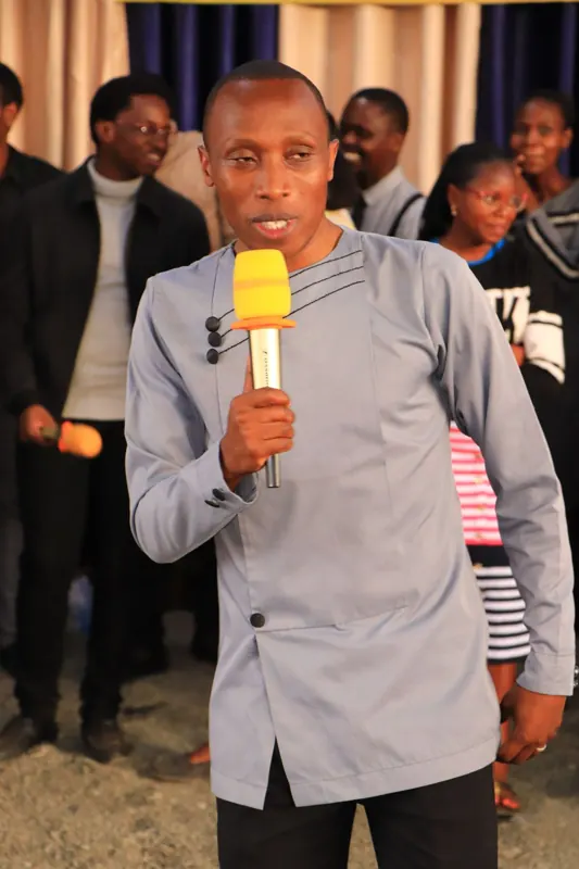 Simon Mugetha speaking at a youth event